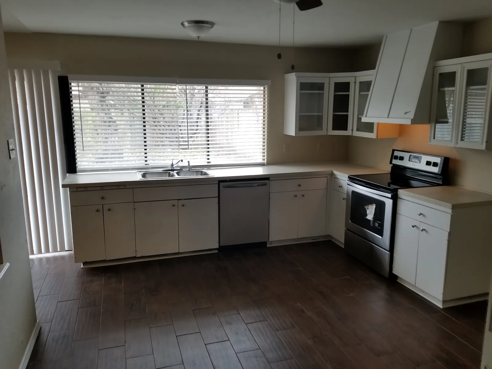 L-shaped kitchen with window over the sink — after renovation