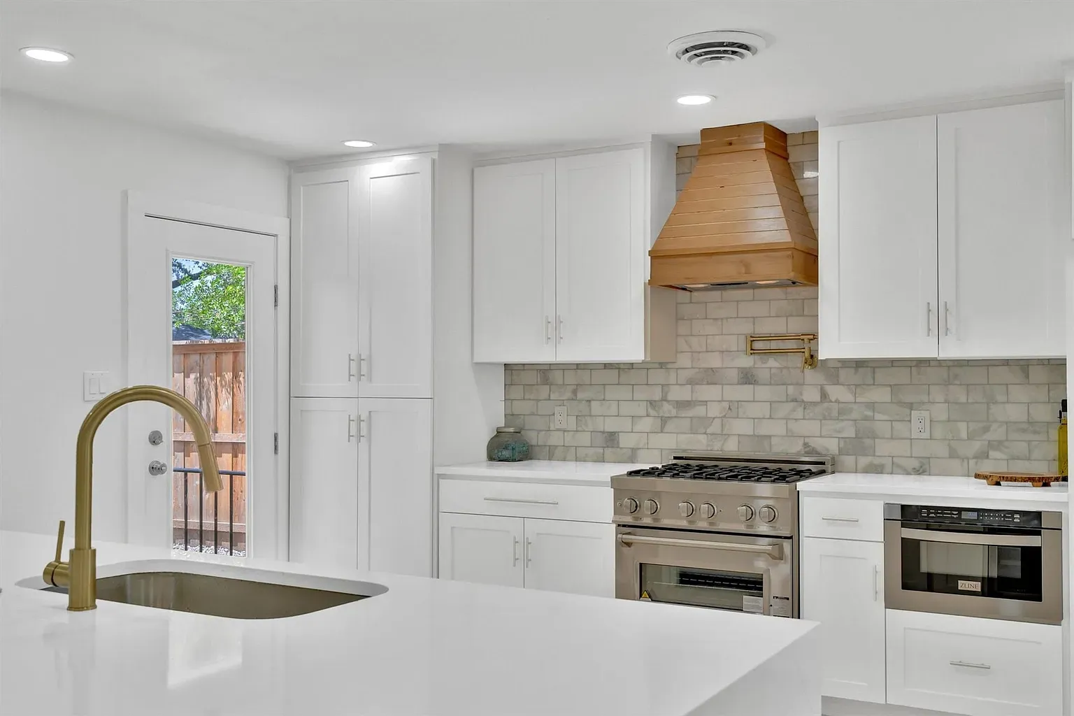 Kitchen looking at the range wall — after renovation