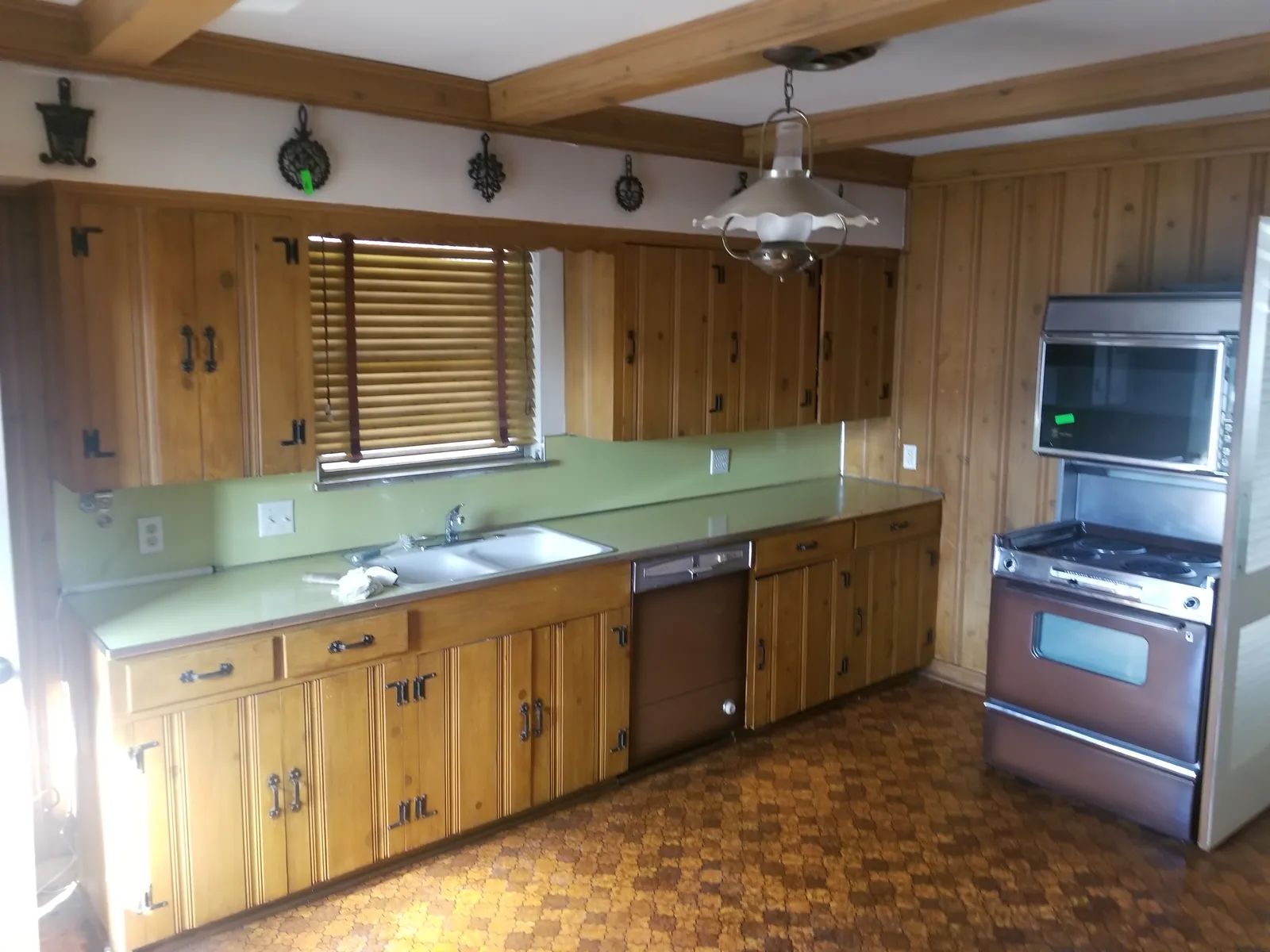 Kitchen looking at the range wall — before renovation
