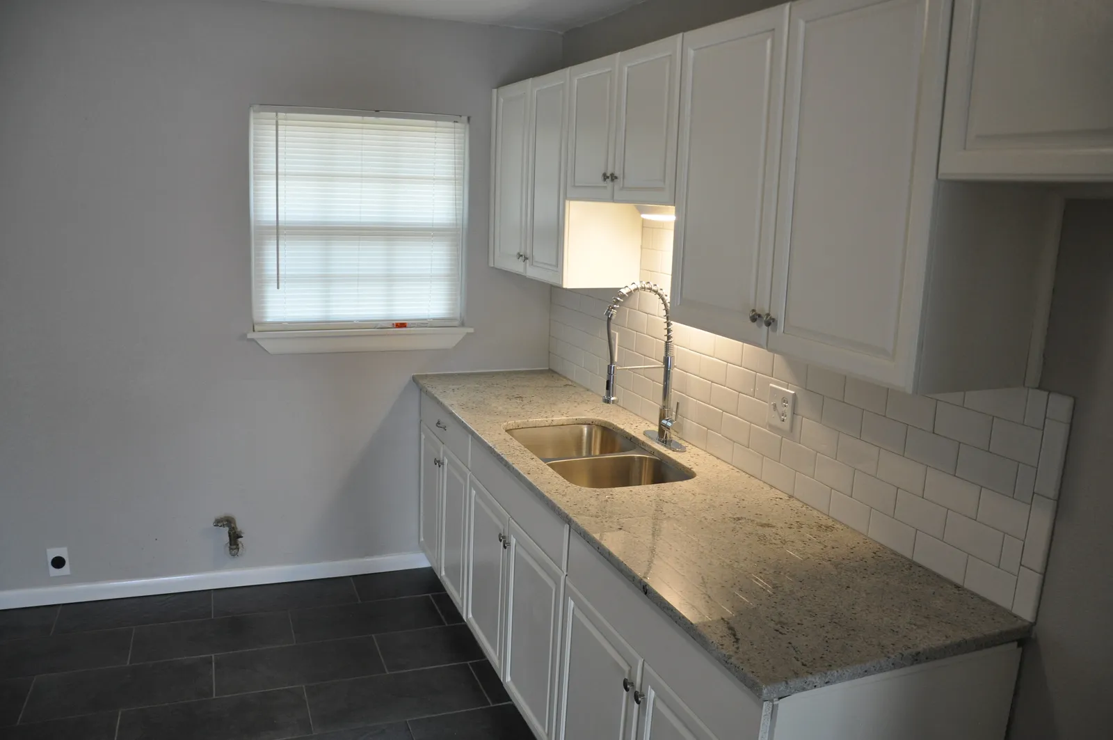 Kitchen run along the window wall — after renovation