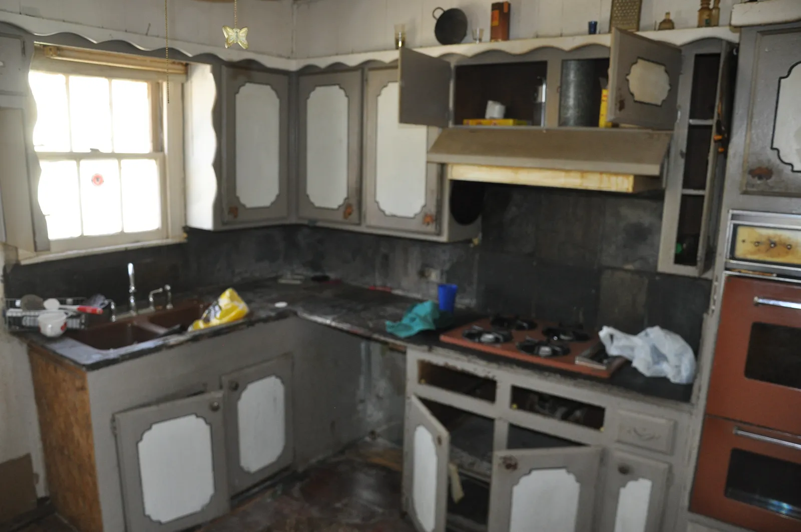Kitchen with the sink under the window — before renovation